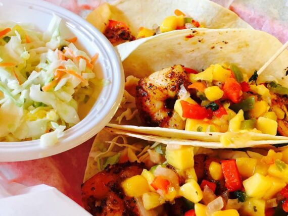 Fish tacos are one of the many specialties that you can enjoy when you come to the Boathouse Tiki Bar and Grill
